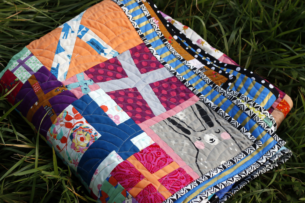 Bright, Colorful quilt. Stitched in Coloir.jpg